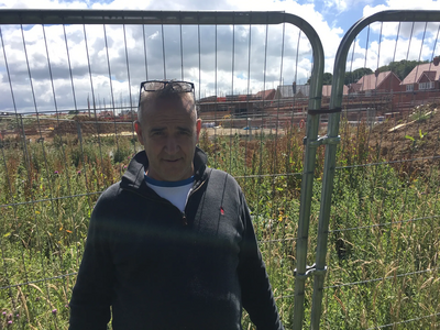 LibDem Wealden District Councillor Neil Cleaver at the polluted pond, Cuckoo Meadow, Hailsham, July 3, 2020 - photo by Katrina Best