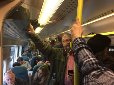 Uckfield LibDem District Council Candidate Tim Murray keeps his cool on a crowded train to London